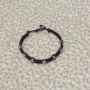 Purple beaded bracelet with silver beads